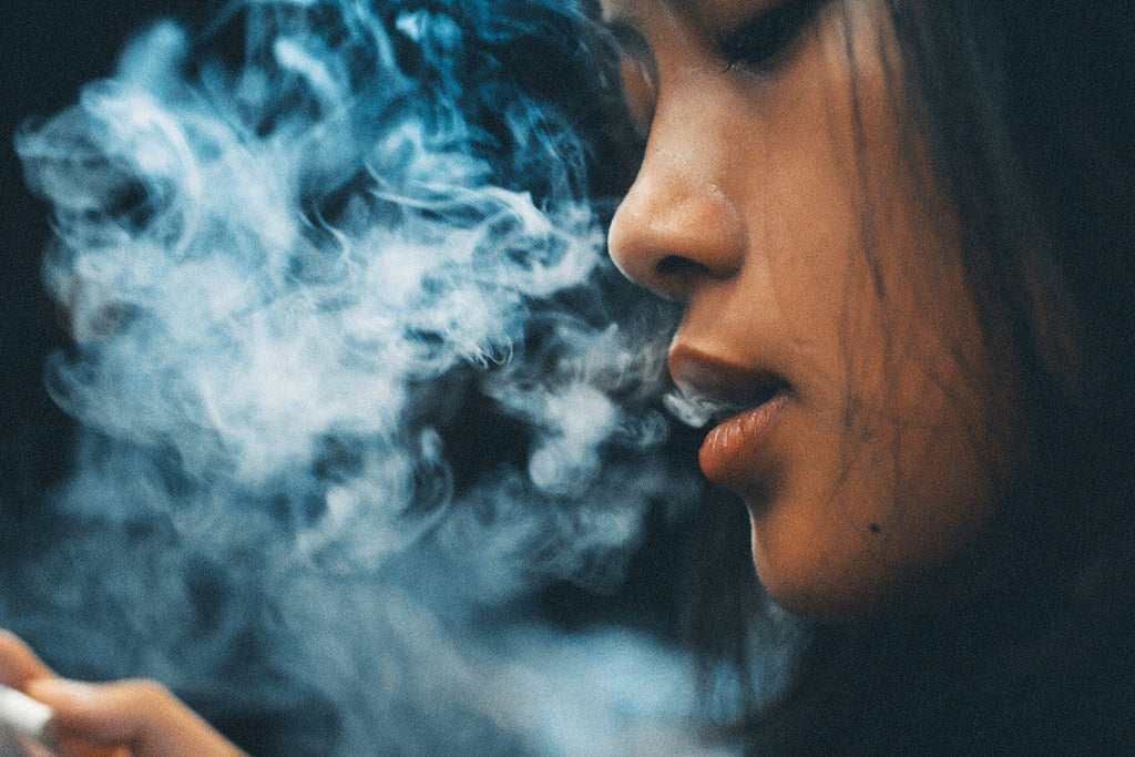 Woman smoking a CBD pre-roll